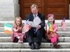 Repro Free 3/7/2012. News. Getting in to the spirit of the U.S. National Holiday on July 4 An Taoiseach Enda Kenny T.D. was on hand today (July 3) to launch the JFK50 a year of planned events to celebrate the historic visit of President John F Kennedy to his hometown of New Ross, County Wexford fifty years ago in 1963. An Taoiseach is pictured with Evelyn McCormack and Peig Waters reading the Kennedy 50th anniversary brochure. The years events are outlined on JFK50Ireland.com  Photograph  Patrick Browne
